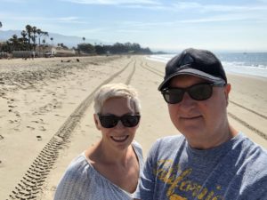 Marc Baumann, digital marketing leader, with wife at East Beach in Santa Barbara